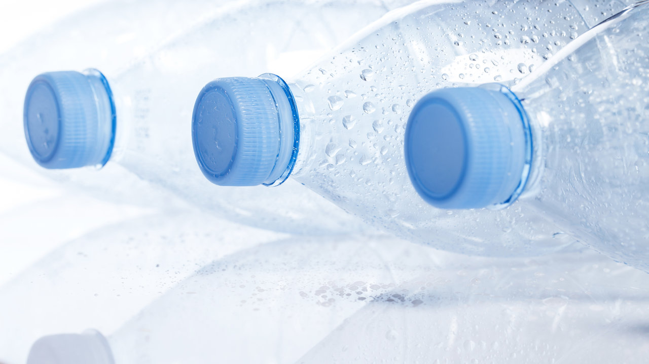 Empty water bottle on white background