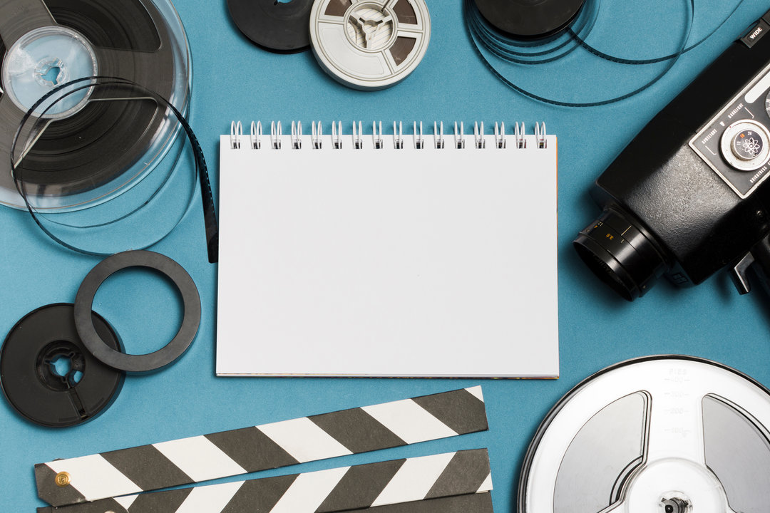 flat-lay-notebook-cinema-equipment